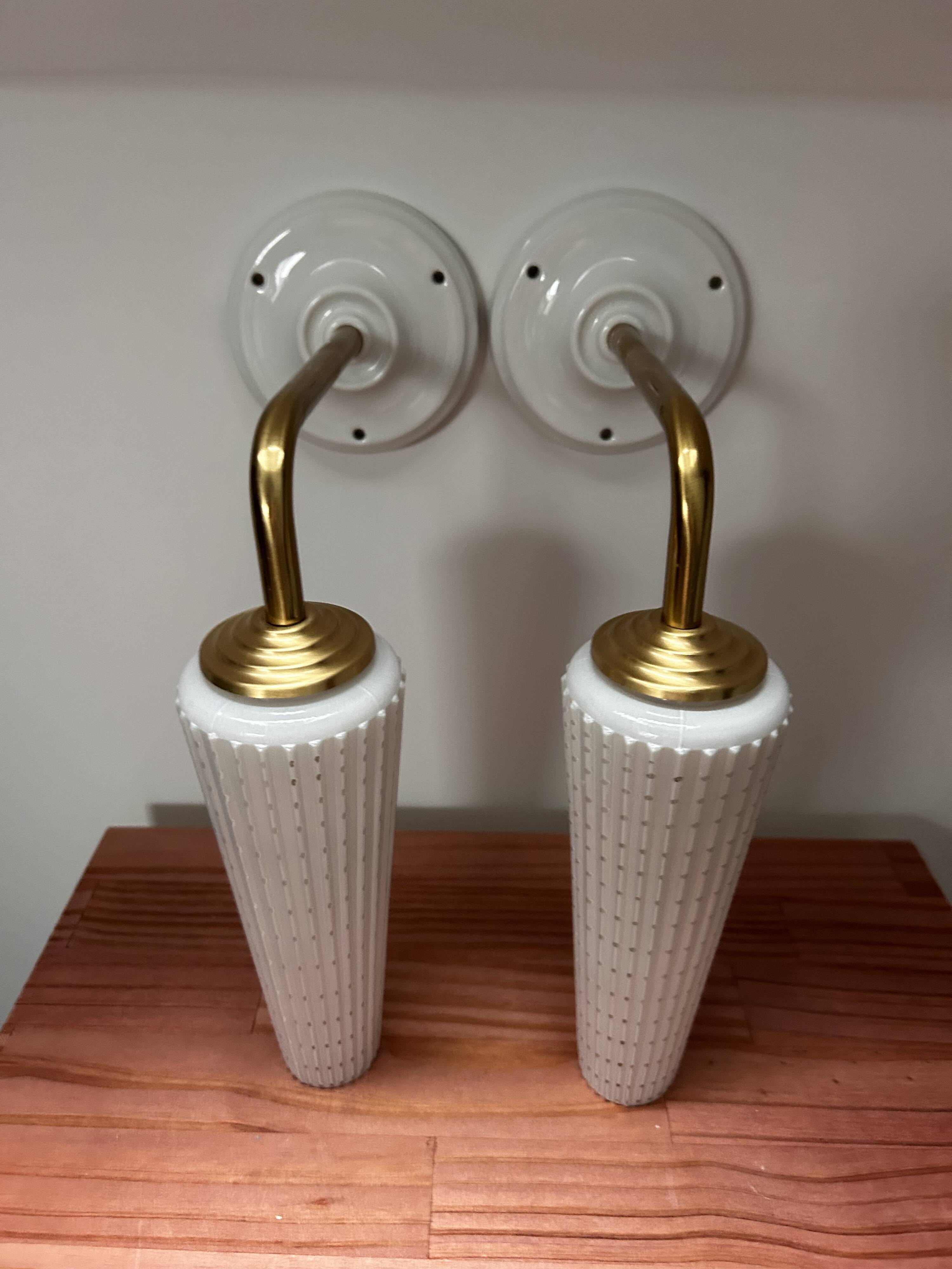 Pair of white and gold wall sconces