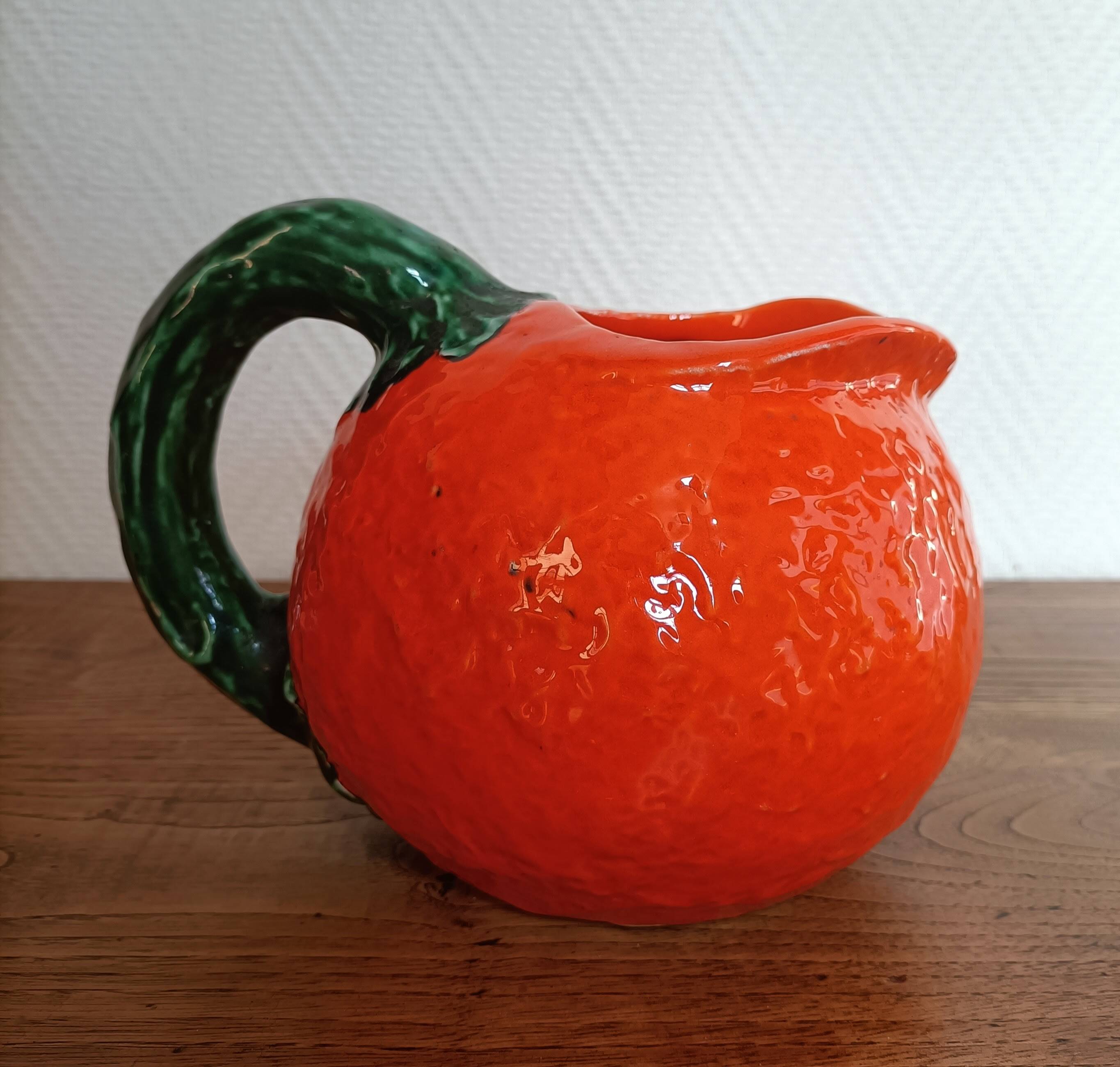 Orange pitcher in Corsican slip