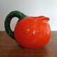 Orange pitcher in Corsican slip