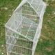 Old bird cage in the shape of a house
