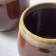 Service of 6 coffee cups in handcrafted glazed ceramic, amber brown, 1970.
