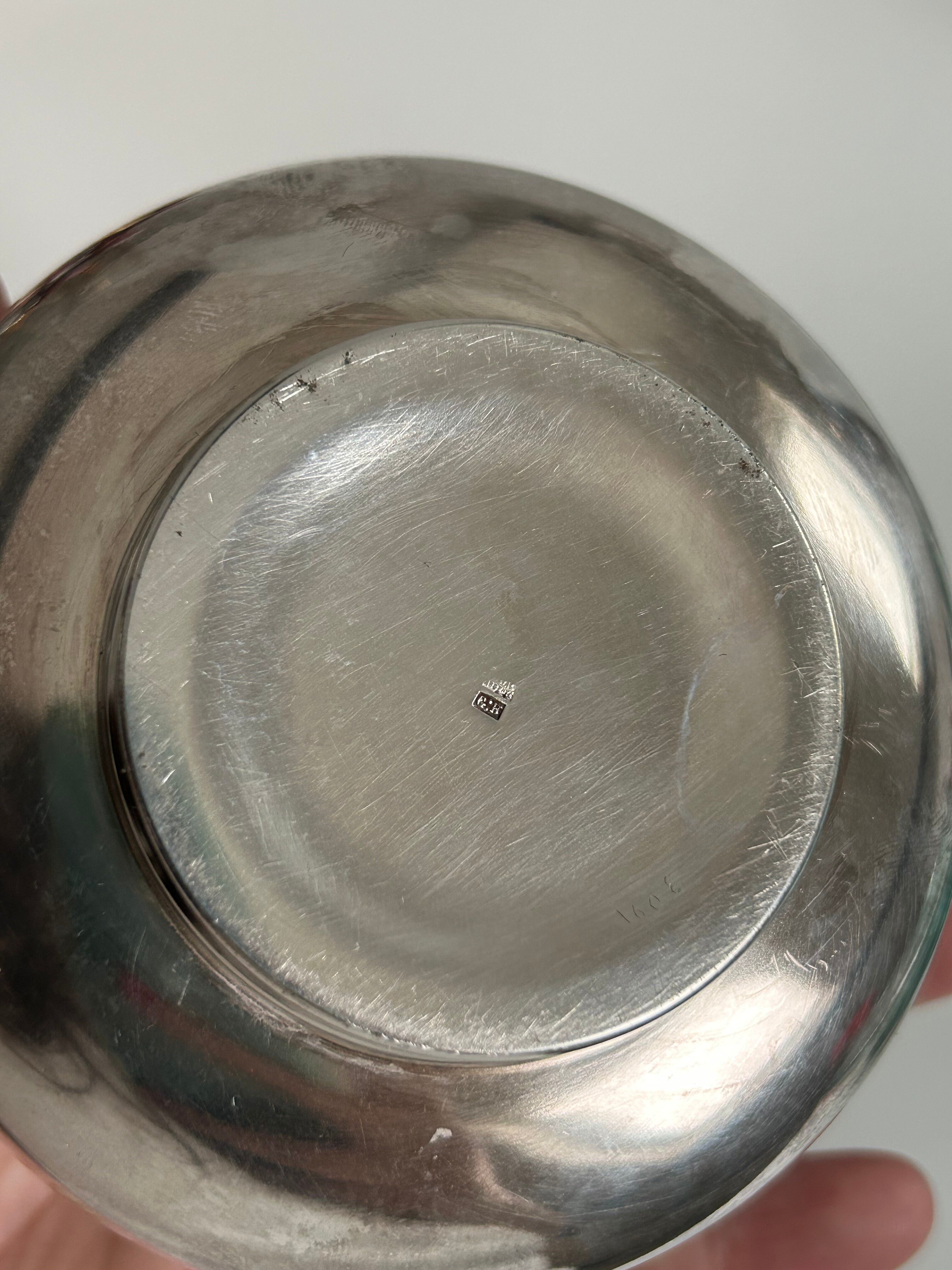 Vintage silver cup with a glass interior.