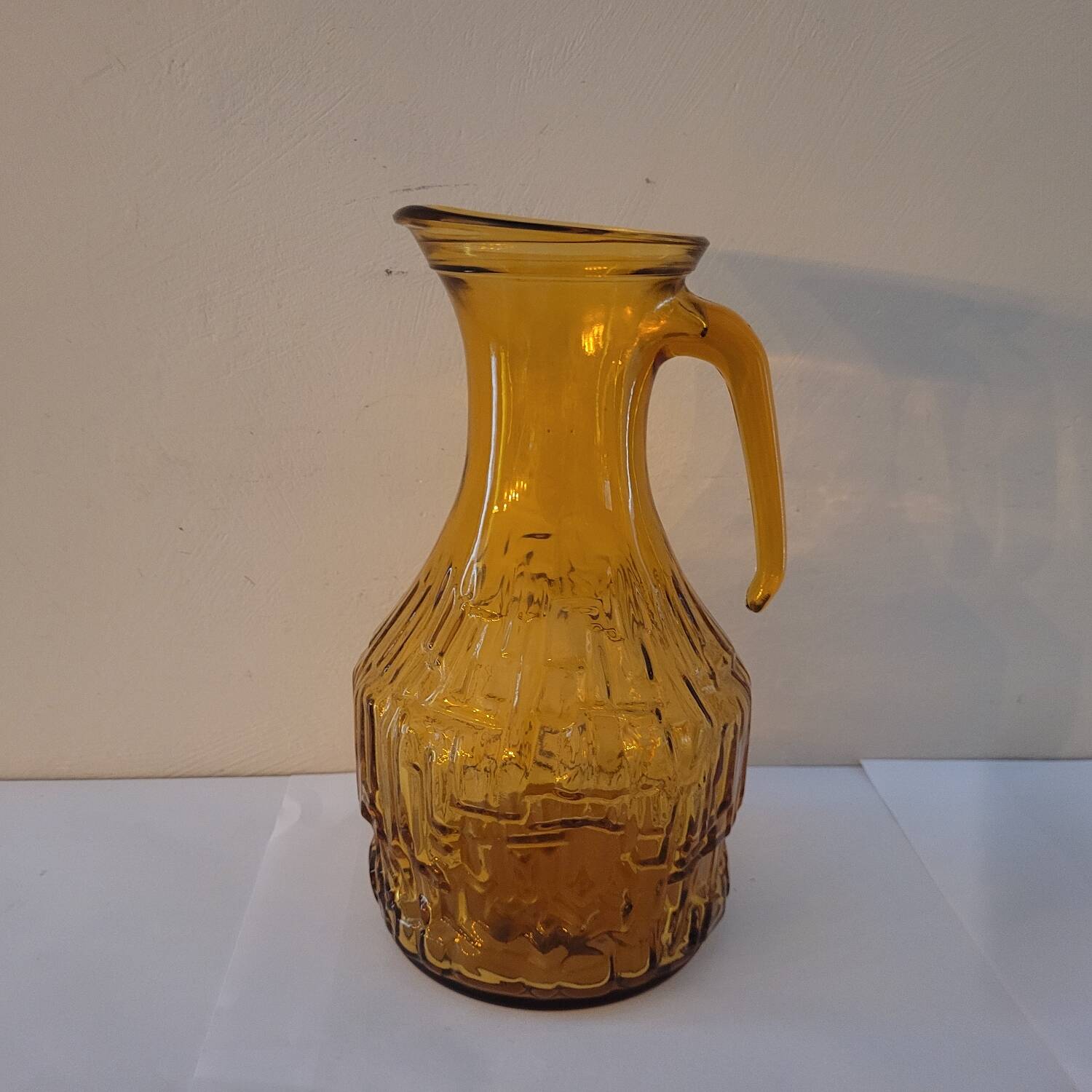 Amber relief glass pitcher. 1970s