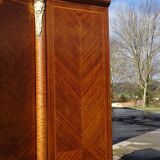 Louis XVI armoire with marquetry and gilded bronze