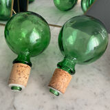 Two green glass decanters