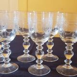 Six engraved crystal wine glasses. 1930