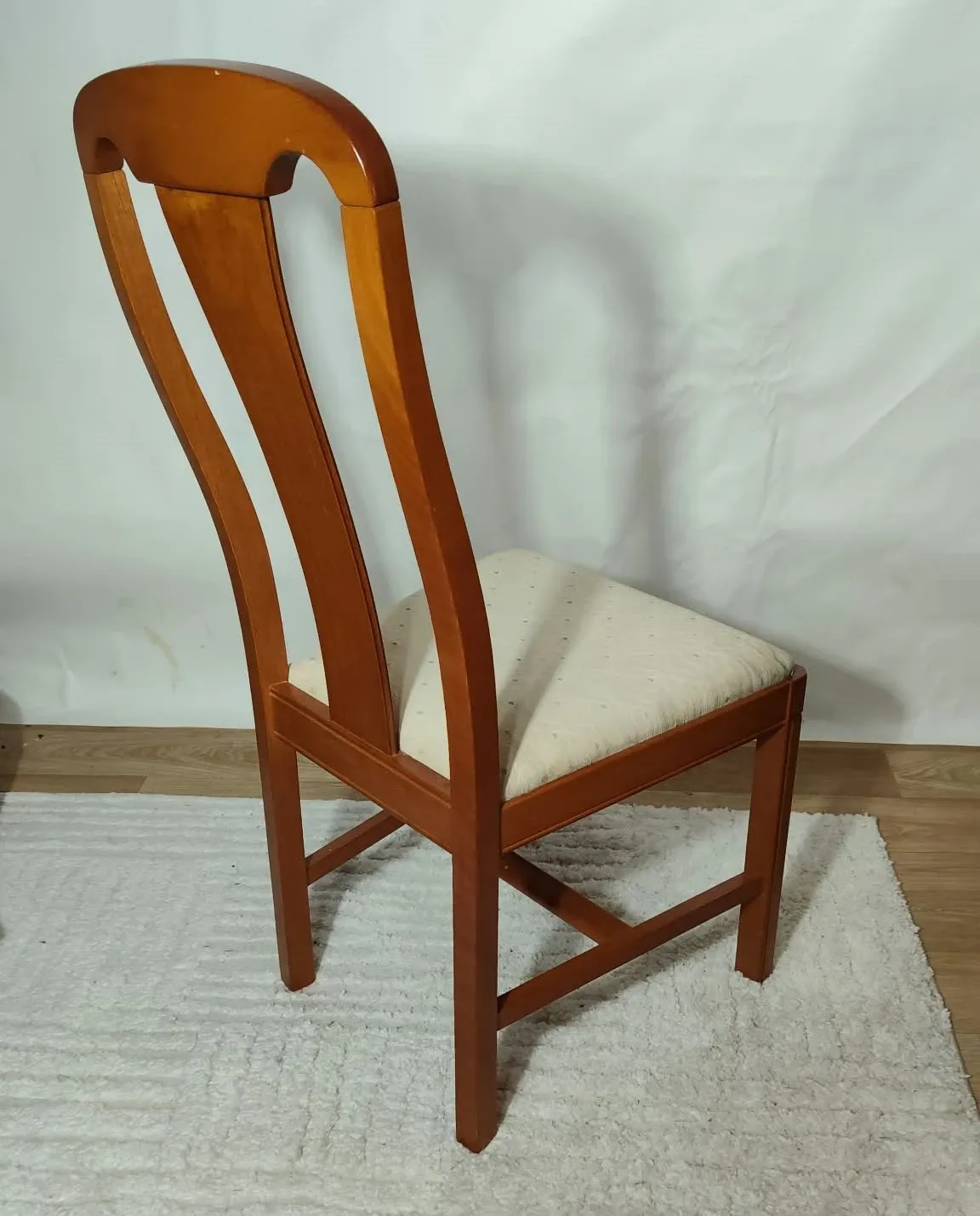 Set of 4 vintage chairs in stained wood and cream fabric.