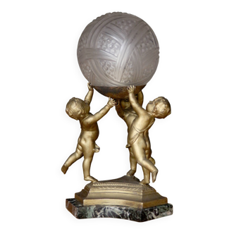 ART DECO lamp with cherubs. In the style of Des Hanots