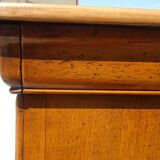 Chest of drawers with decorated handles in the Louis XVI style.