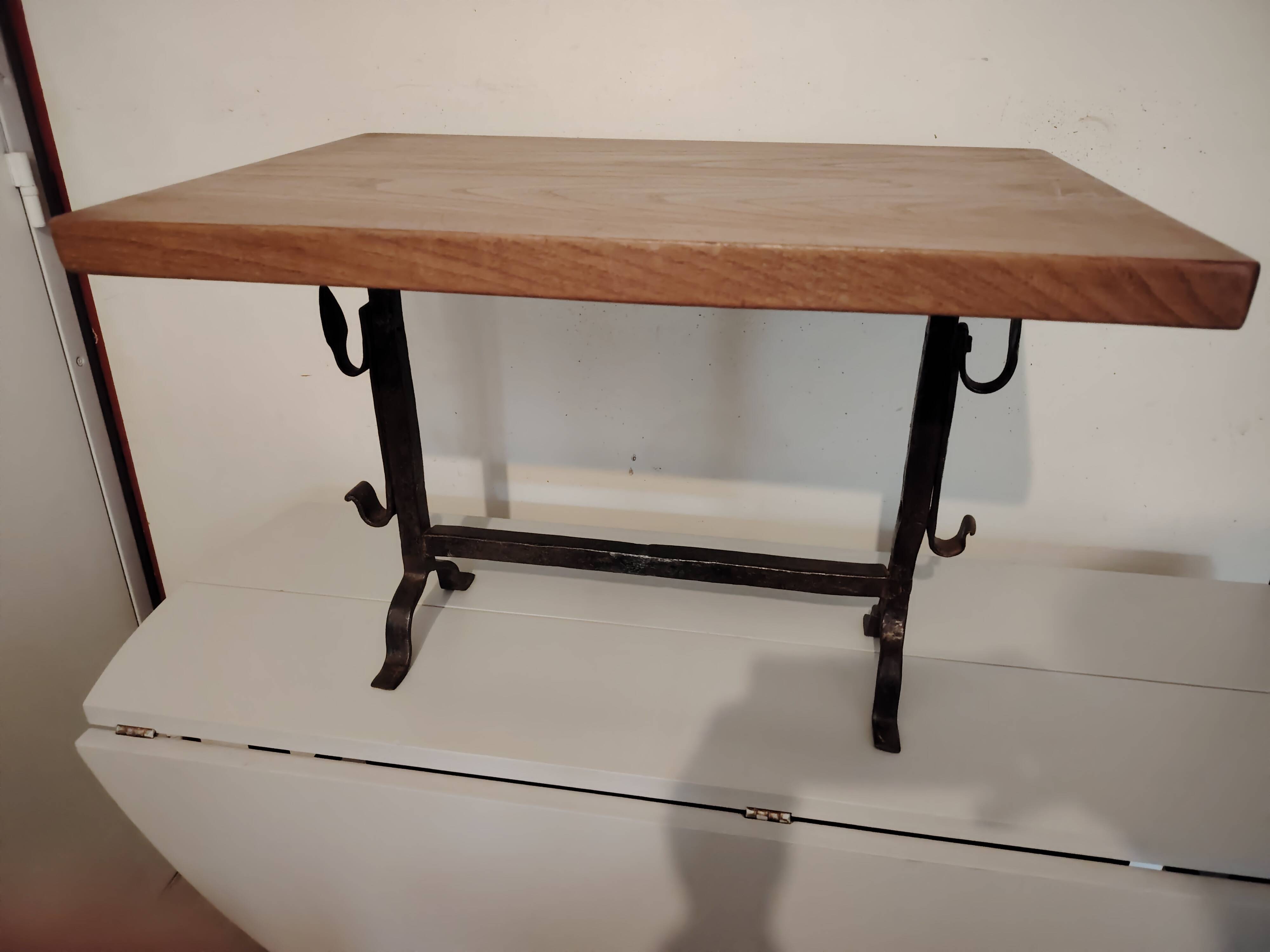 Solid wood and wrought iron coffee table