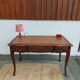 Louis XV style desk in wood, with a brown leather top.