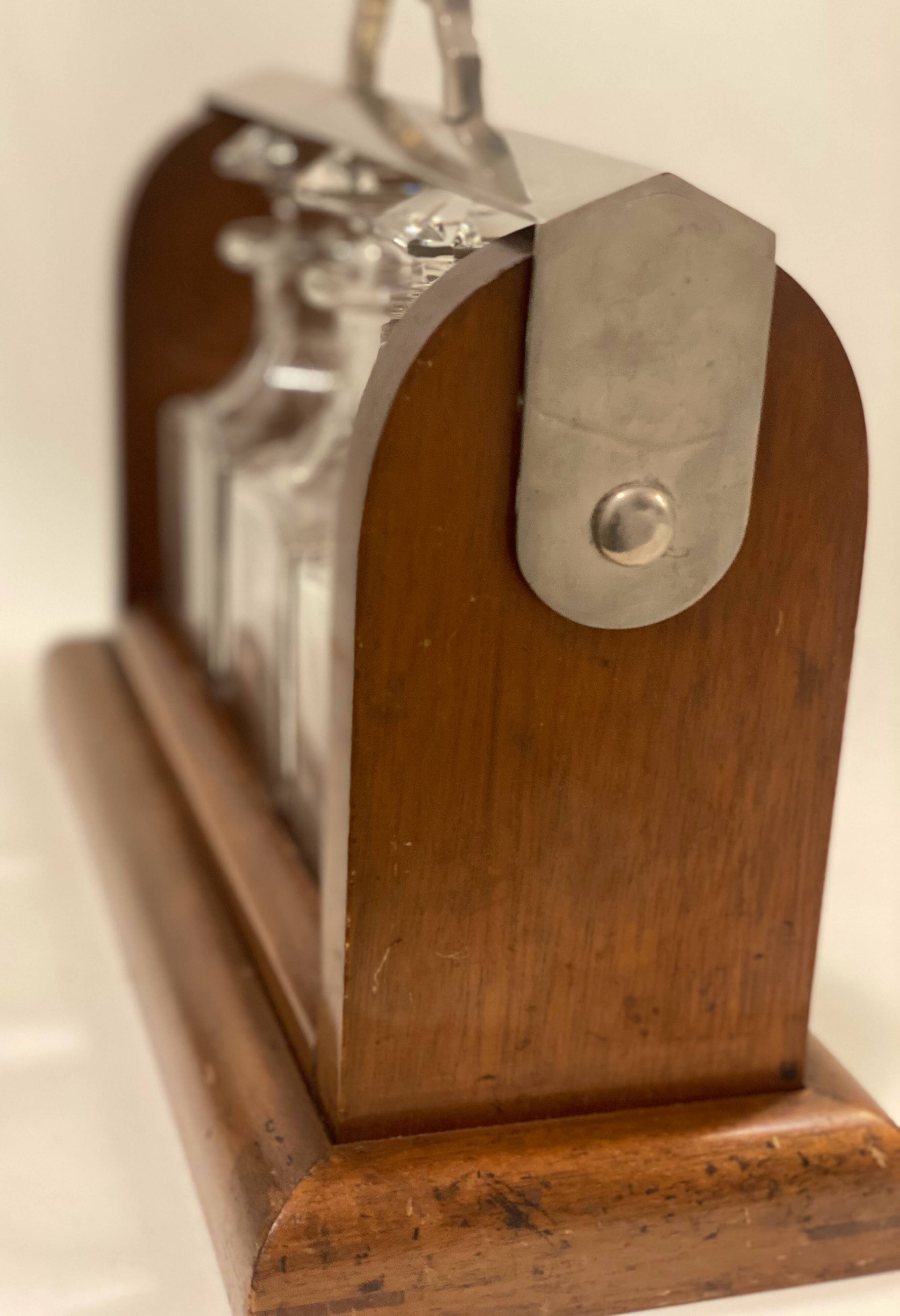 Portable Art Deco liquor cabinet in mahogany & metal with 3 Baccarat crystal bottles.