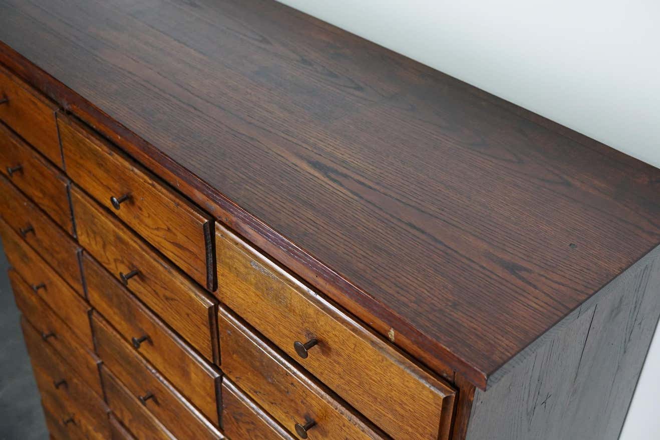 Antique apothecary furniture in oak France early twentieth century