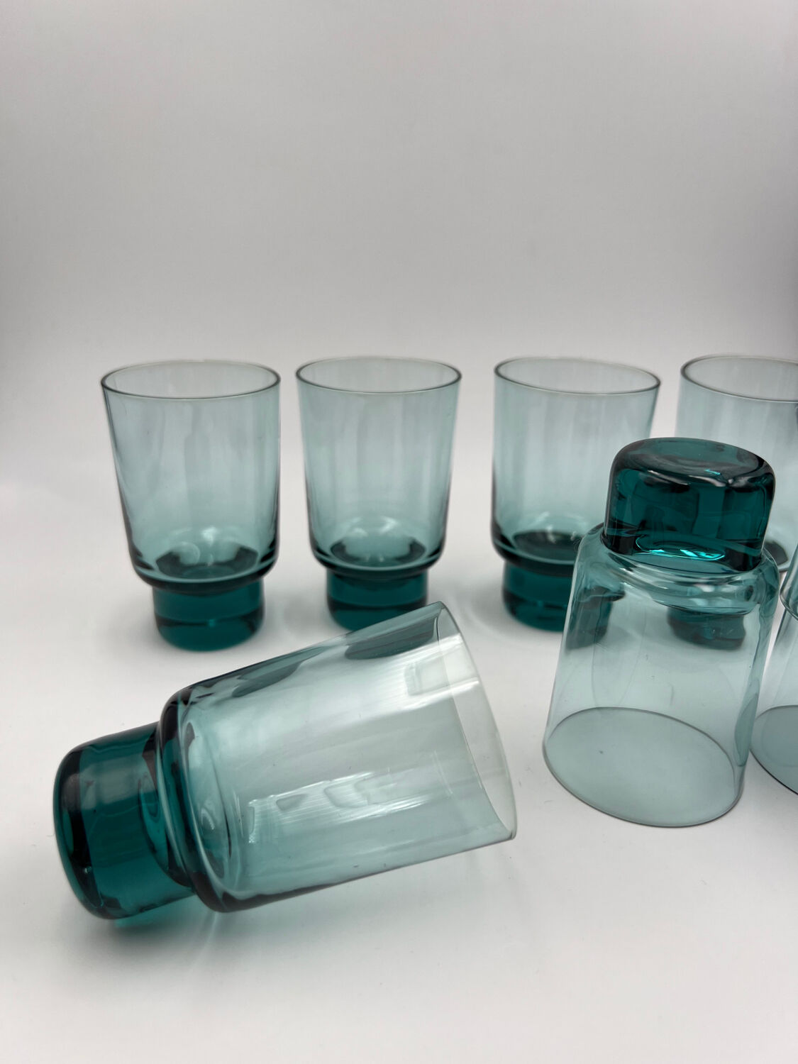 Eight bluish glass water glasses
