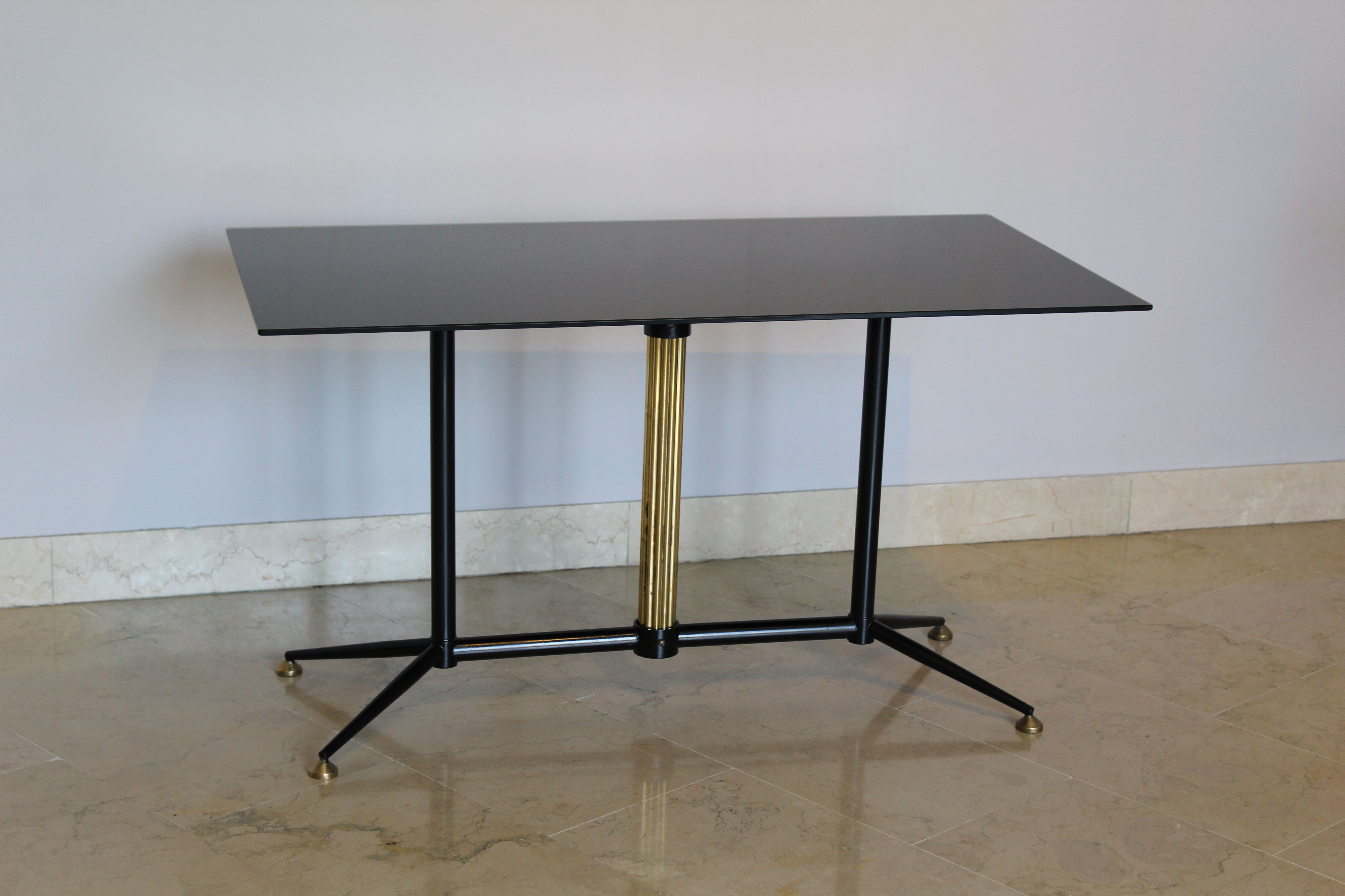 Coffee table in black glass lacquered brass and iron, Italy 50s