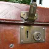 Old monogrammed leather travel suitcase and barony crown
