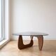 Vintage organic coffee table in smoked glass and walnut.