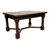 Extendable oak table from the 1930s with Gothic decoration.
