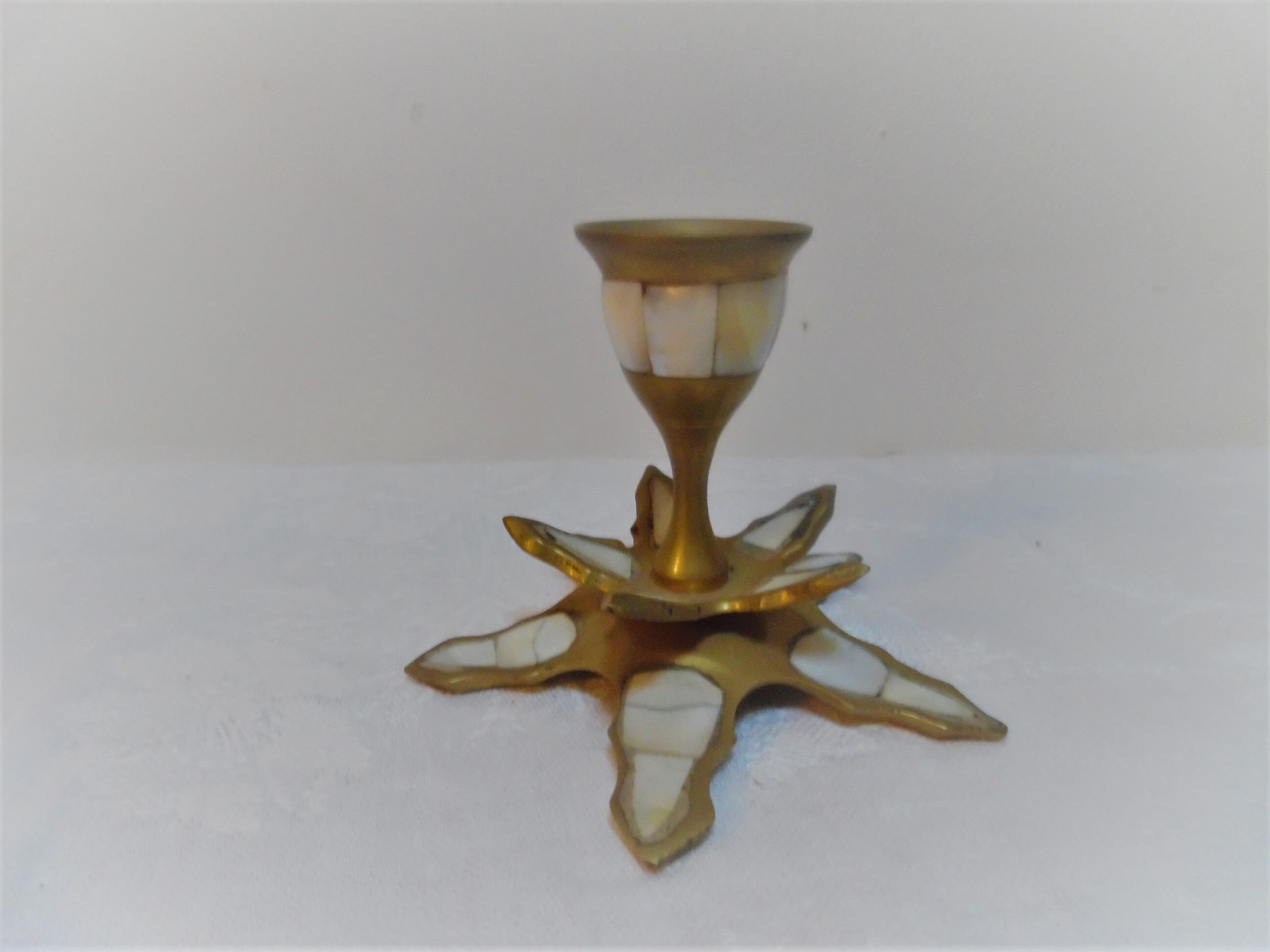 Brass and mother-of-pearl candlestick