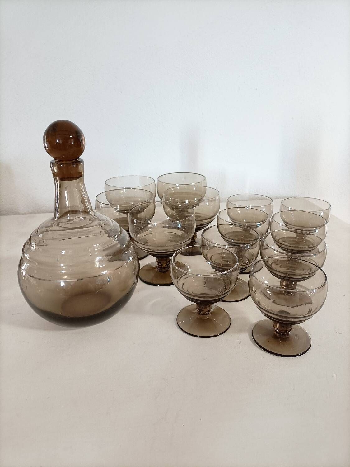 Smoked glass glasses and carafe from the 60s and 70s