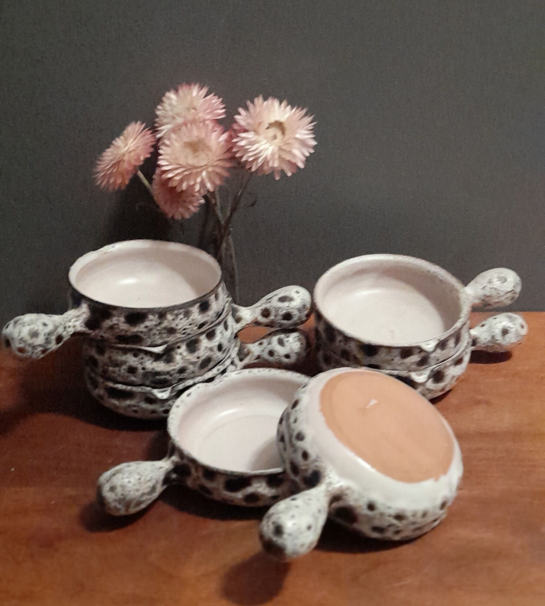 Set of 8 individual poelons/cassolettes, fat lava, stamped Vallauris