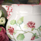 Old white and pink teapot