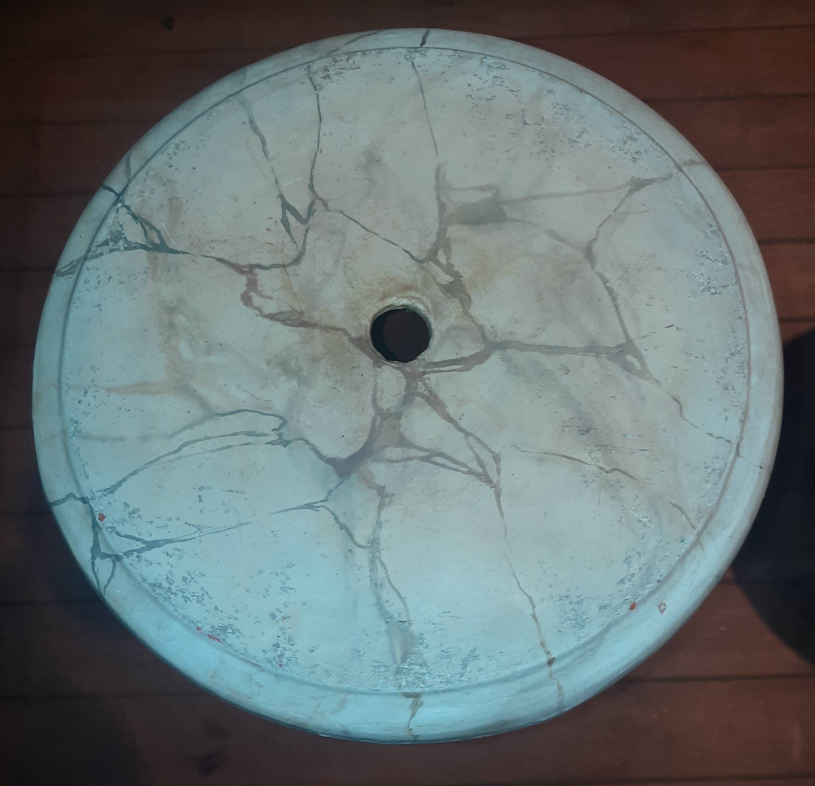 Column topped with a plaster basin.