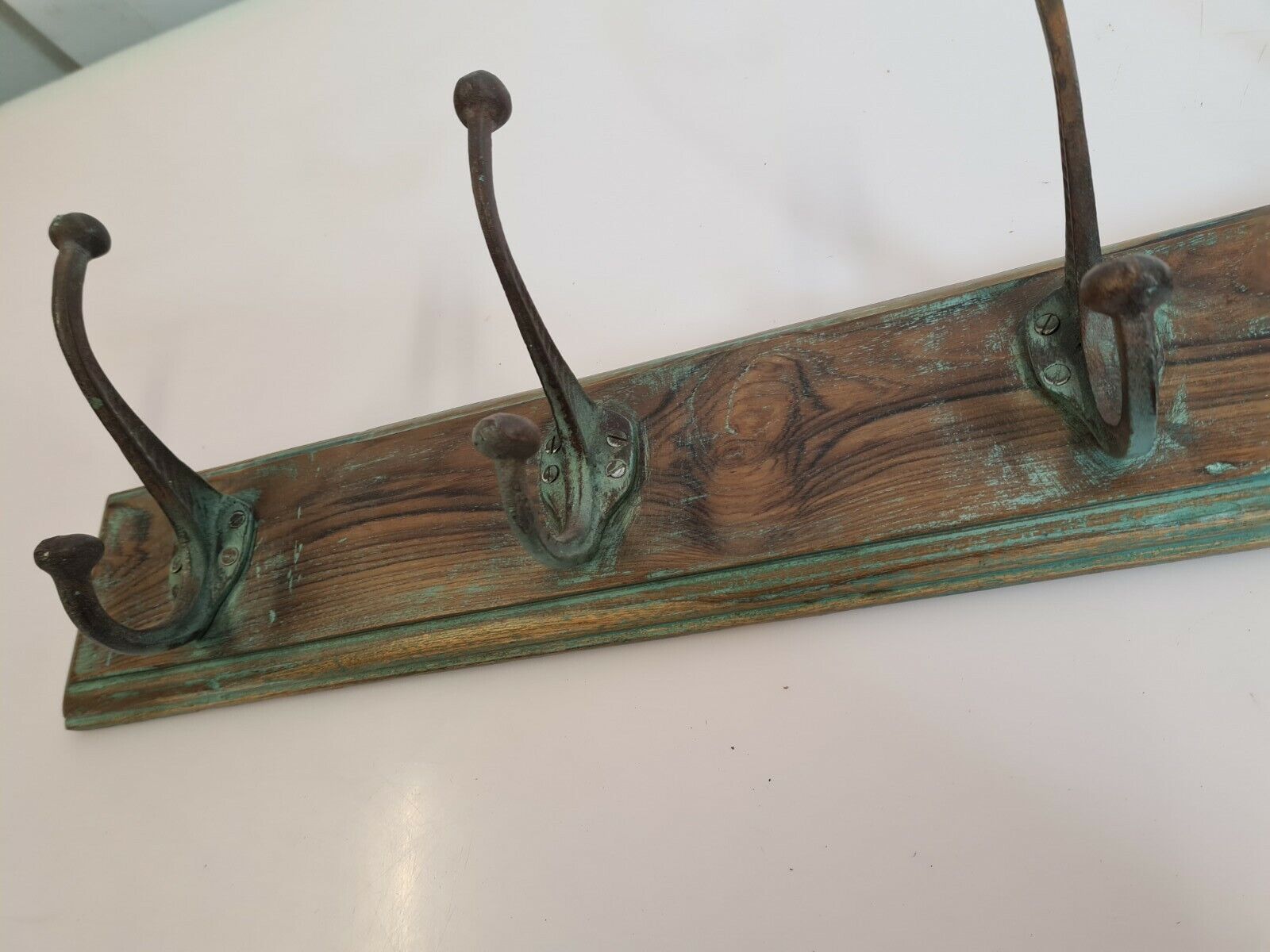 Wooden school coat rack with cast iron hooks