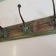 Wooden school coat rack with cast iron hooks