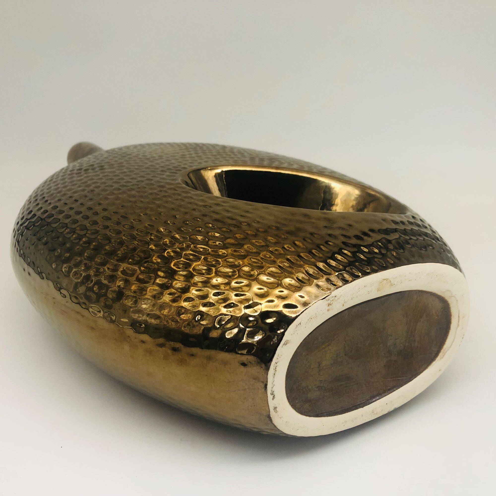 Golden ceramic vase.