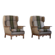 Pair of high-back lounge chairs in modern Danish style in the manner of Henning Kjærnulf, 1960s.