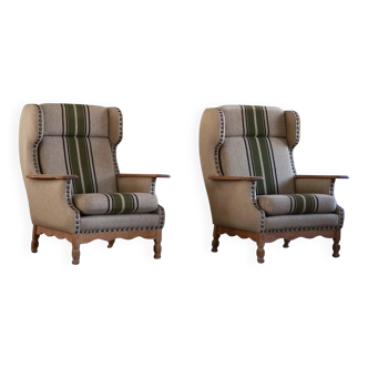 Pair of high-back lounge chairs in modern Danish style in the manner of Henning Kjærnulf, 1960s.