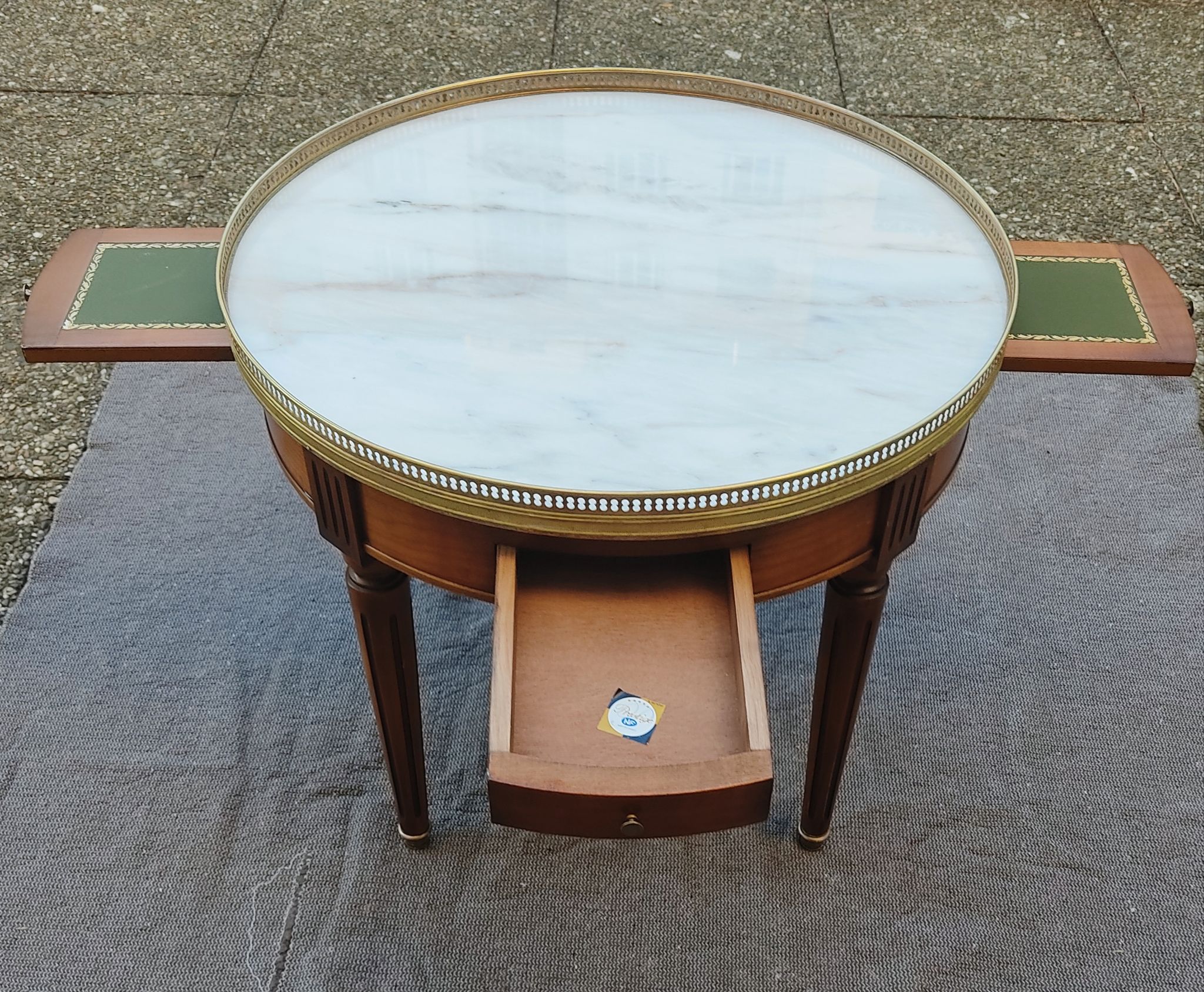 French hot water bottle table in Louis XVI style (1890); marble top and bronze gallery