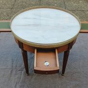 French hot water bottle table in Louis XVI style (1890); marble top and bronze gallery
