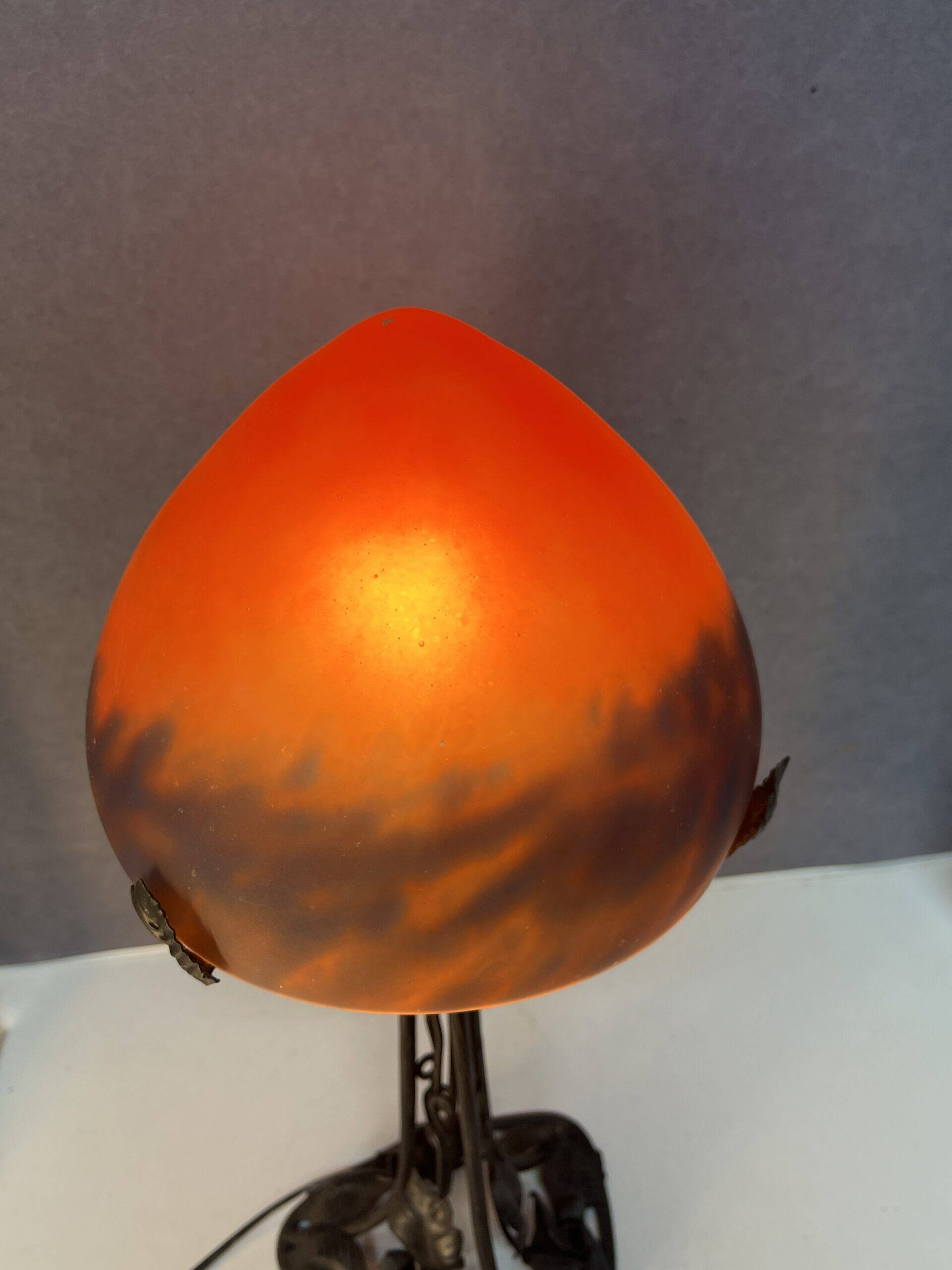 Contemporary mushroom lamp, wrought iron base and orange glass shell with blue hues in the art deco style