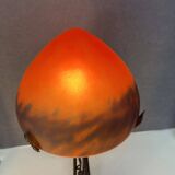 Contemporary mushroom lamp, wrought iron base and orange glass shell with blue hues in the art deco style
