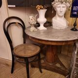 Pedestal table above marble