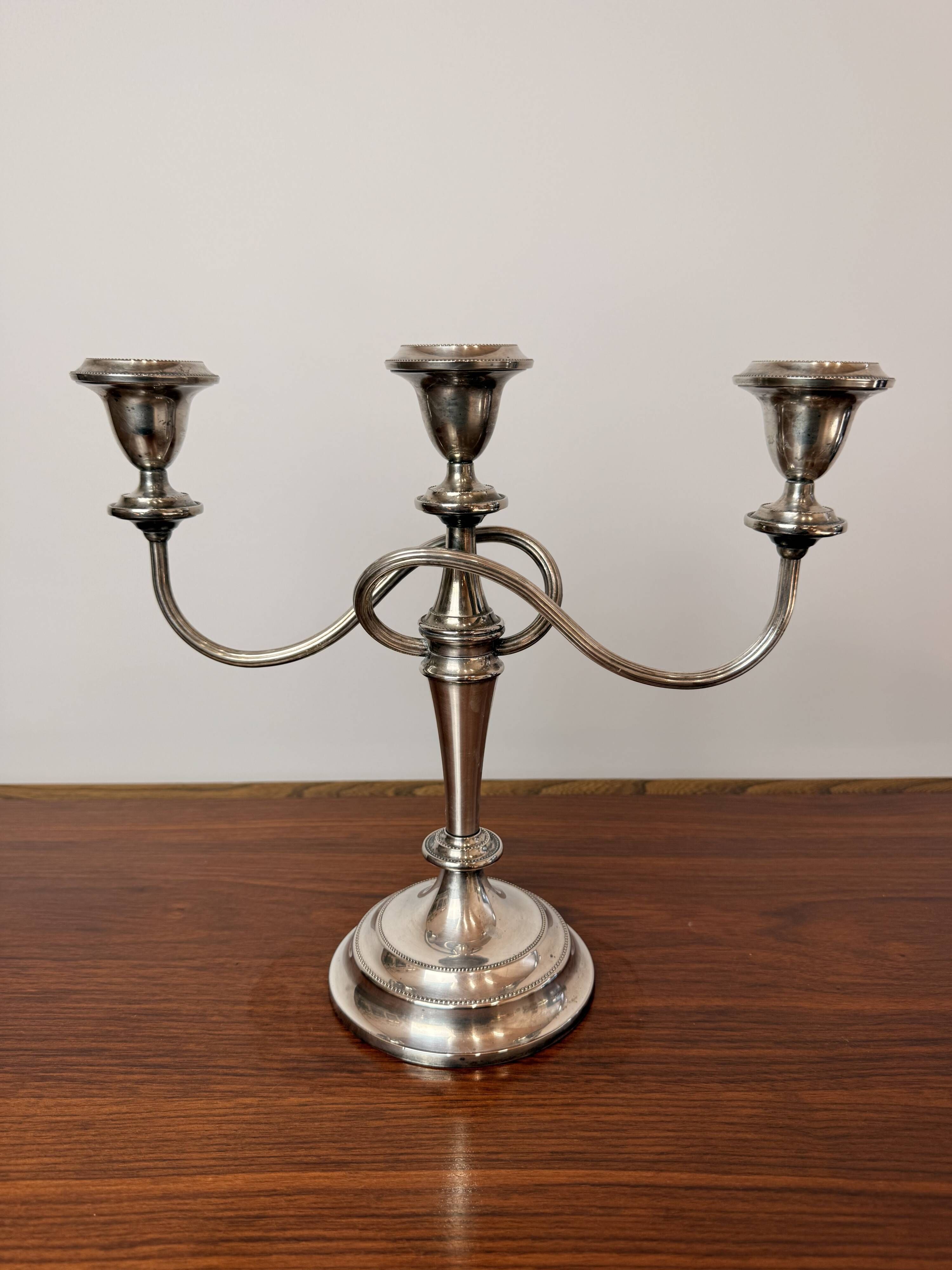Vintage twisted chandelier with three lights in silver-plated metal.