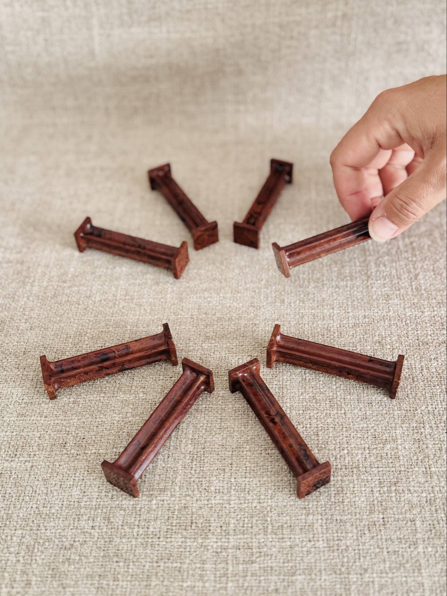 Set of 8 Bakelite knife rests with mahogany effect Art Deco