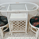 Rattan head-to-head table with vintage armchairs