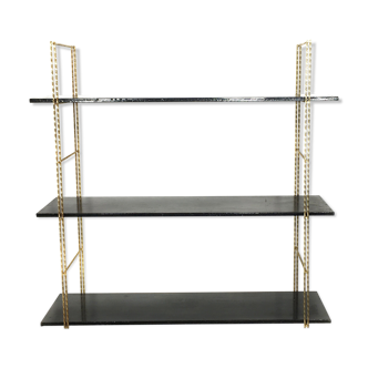 String gold metal shelf and black wood