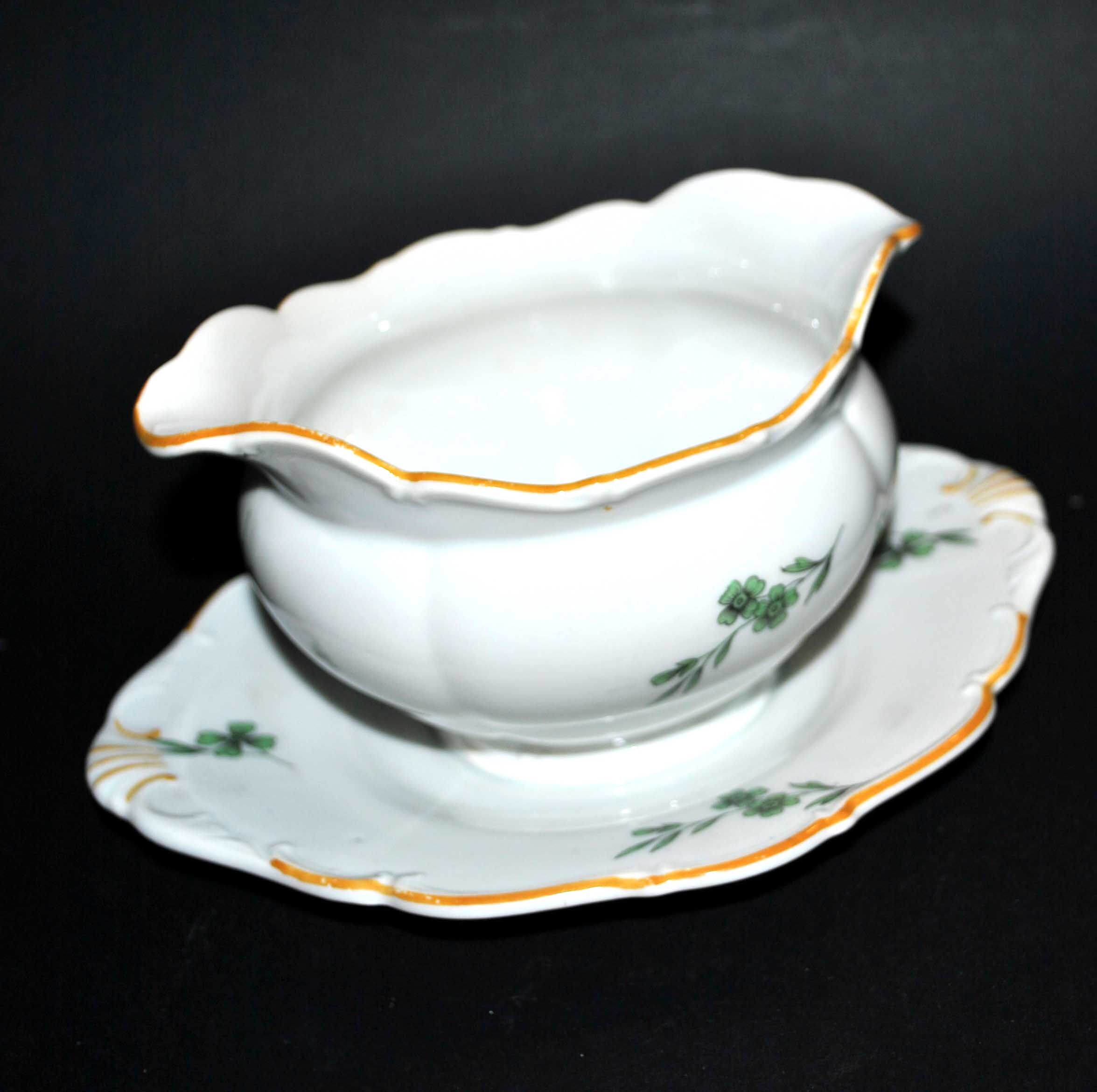 Vintage porcelain pouring saucière decorated with green clover