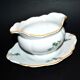 Saucière verseuse vintage en porcelaine ornée de trèfles vert
