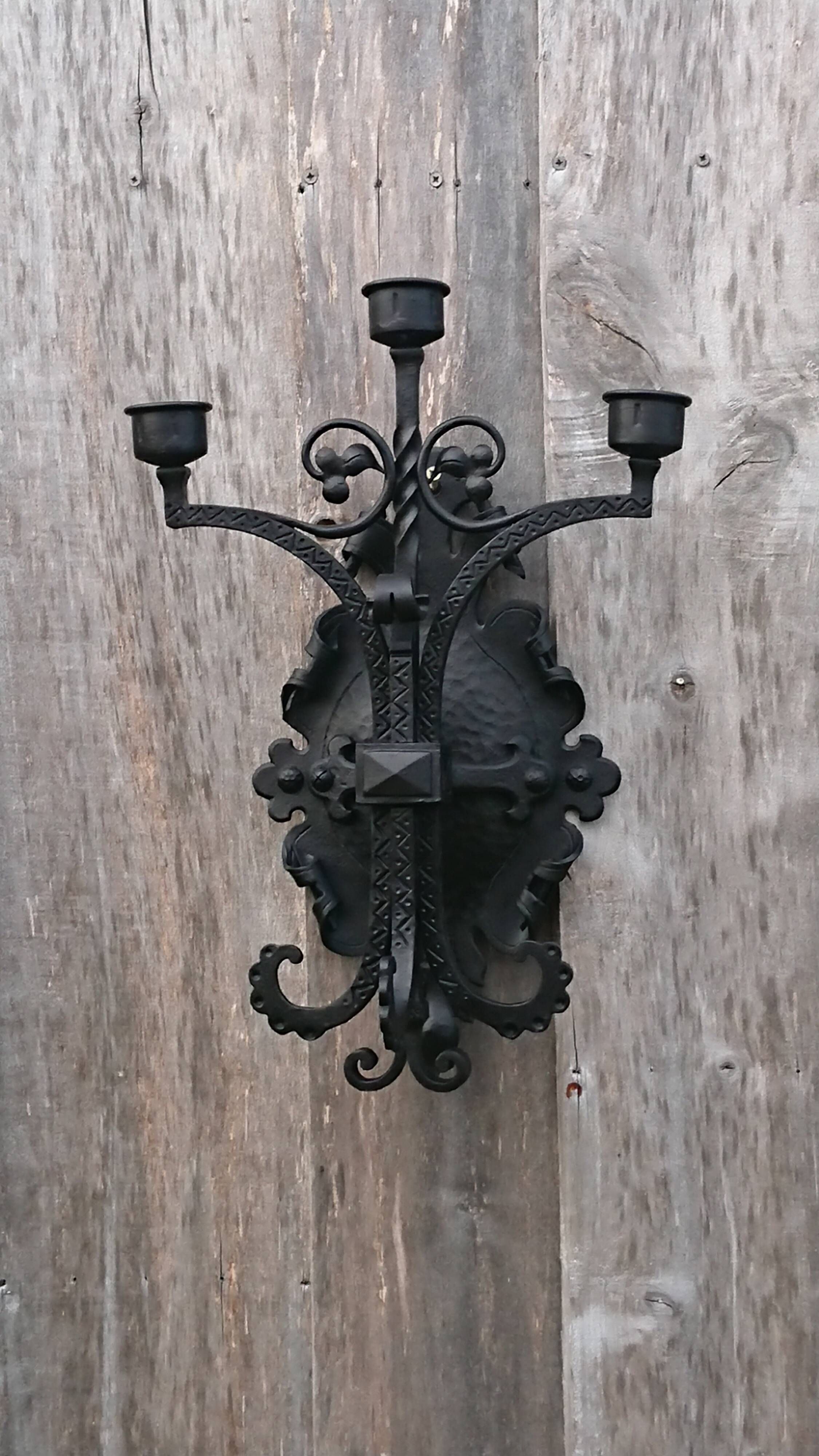 Pair of black wrought iron sconces - neo-Gothic style - from the 1950s