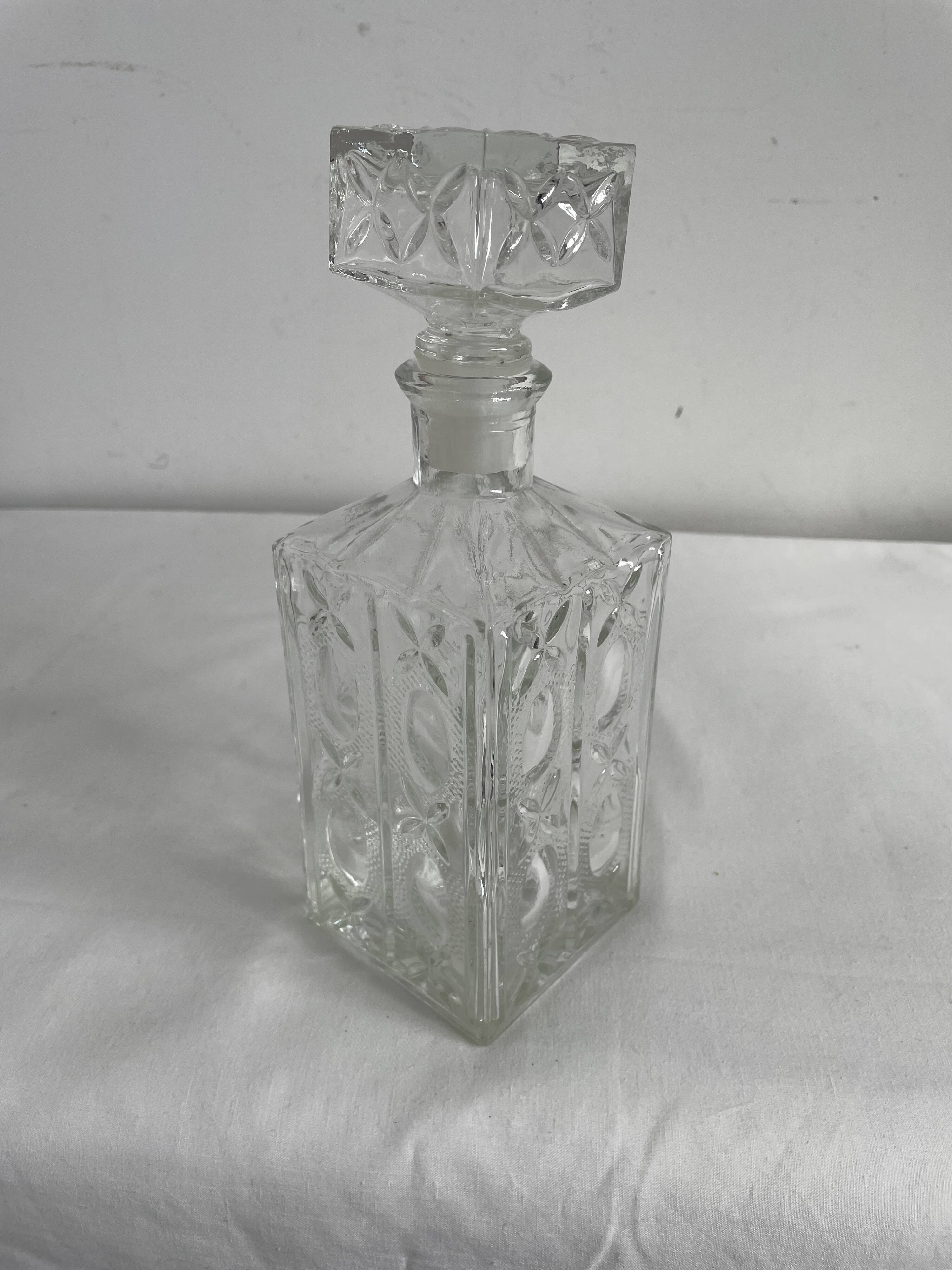 Molded glass carafe, 1960s-1970s, stylized flower decoration, oval, square base, stopper, rosette