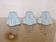Set of 3 pale blue plastic strip lampshades, to clip onto a bulb.