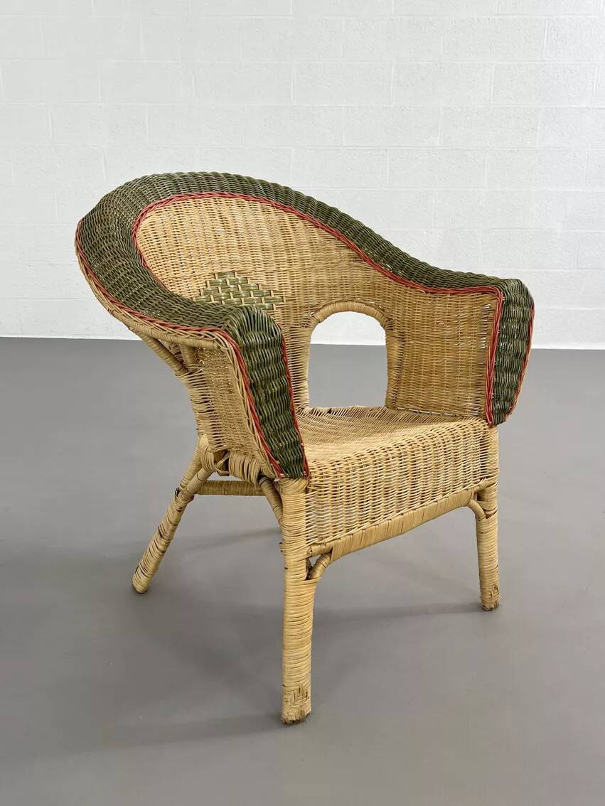 Rattan, wicker and green and red edging cabriolet style armchair
