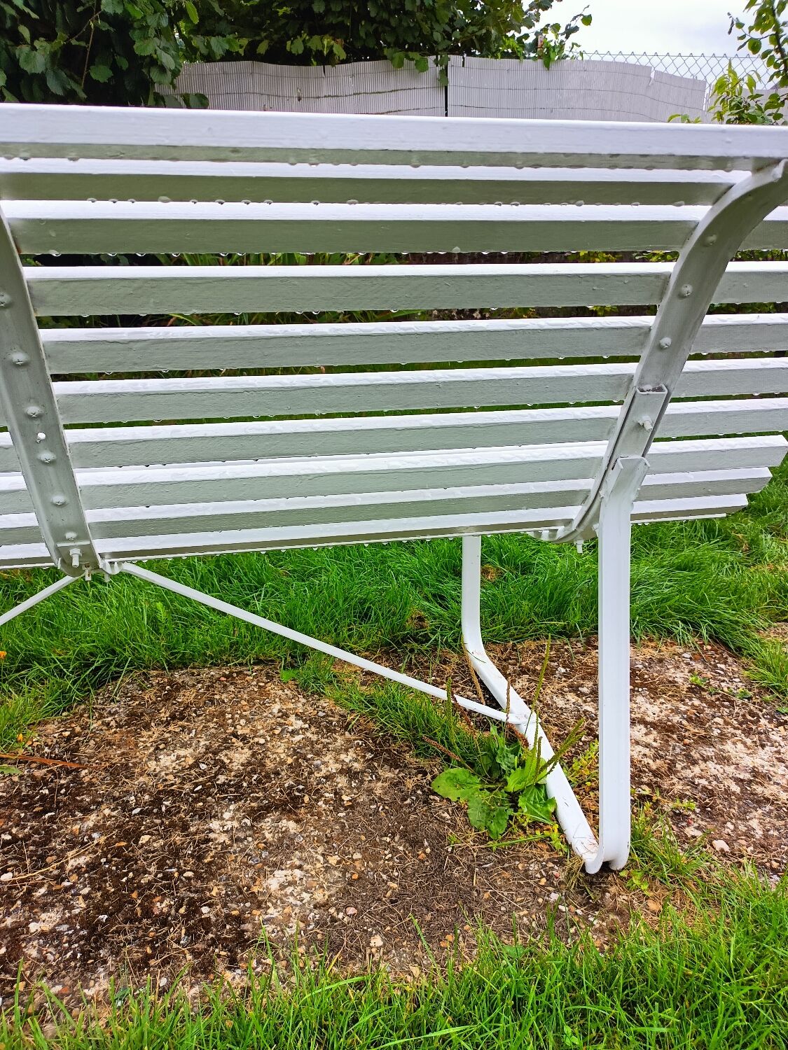 Antique garden bench with metal legs