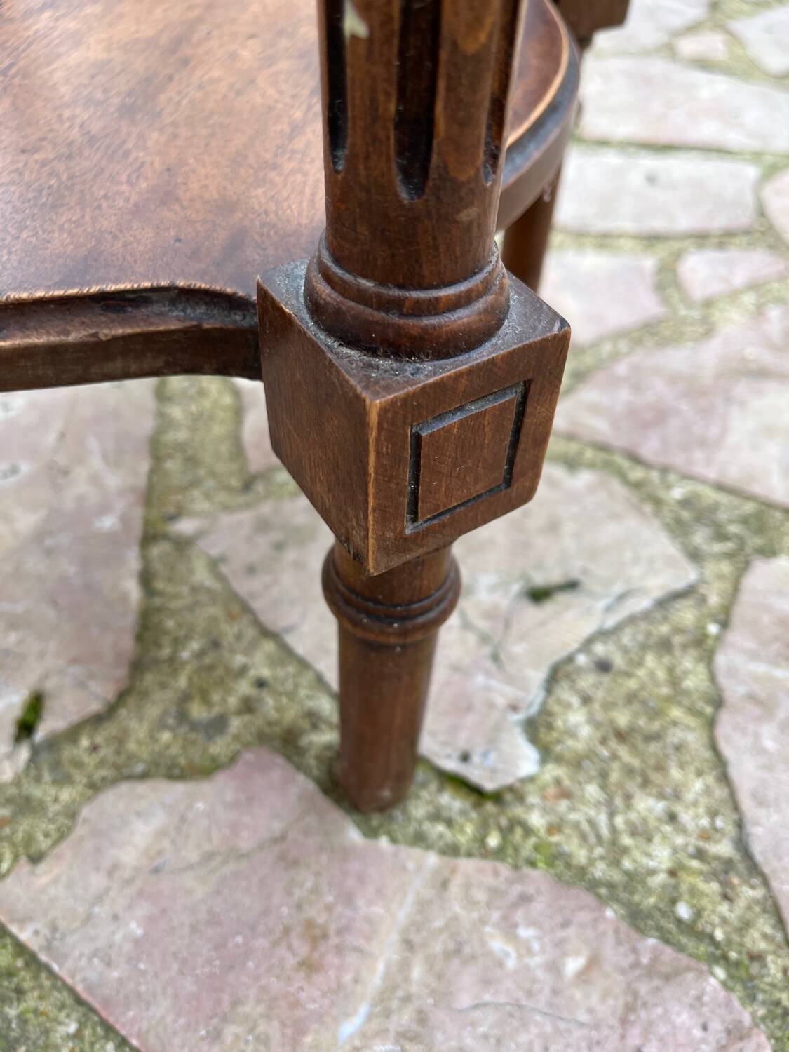 Old wooden pedestal table with marble top