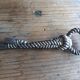 Silver metal rope bottle opener